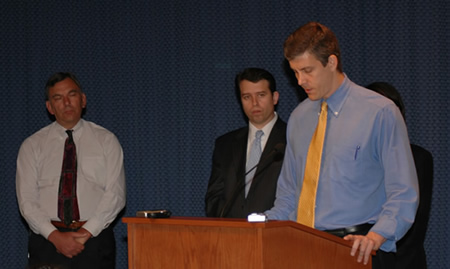 Above Photo (Arne Duncan, David Vitale, Pedro Martinez). June 6, 2007. Duncan’s phony ‘deficit’ and the Shock Doctrine in Chicago’s public schools. On June 6, 2006, Chicago Public Schools CEO Arne Duncan unveiled a proposed budget for the 2006-2007 school year (the “FY 2007” budget) . For six months, Duncan had been proclaiming that the school system faced a “deficit” of more than $300 million and that the failure of the State of Illinois to pay more to Chicago’s schools was forcing the school system to make massive cuts. The most dramatic cuts involved $26.5 million from special education services, resulting in the reduction of approximately 200 teachers and more than 700 special education aides. By the time Duncan announced the FY 2007 budget at the news conference above, however, he and his top financial aides knew that there had been no such deficit. The claim, reported widely in the media, was simply not true. Three of those most responsible for the claim were (left to right above: David Vitale (Chief Administrative Office), Pedro Martinez (Budget Director) and Arne Duncan (Chief Executive Officer). Substance photo by George N. Schmidt.